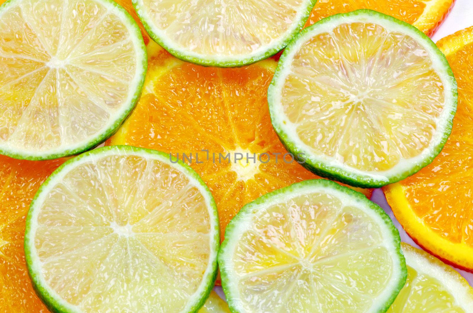 Mixed sliced citrus fruit background