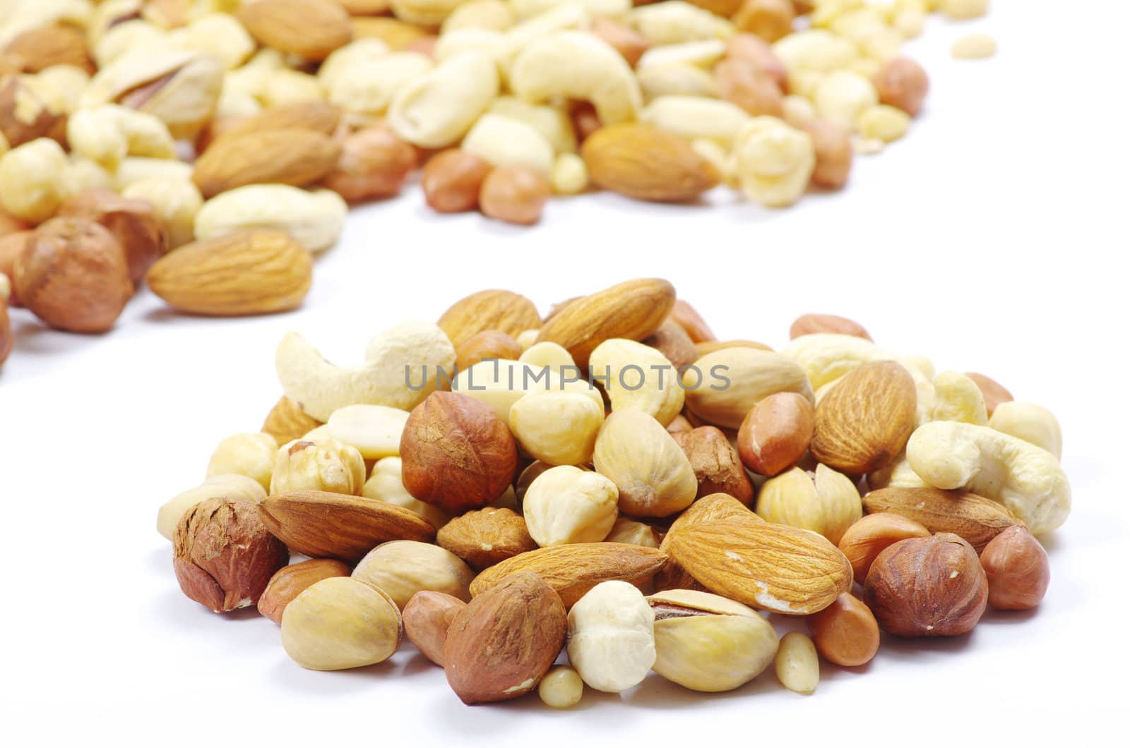 Assorted mixed nuts on white background