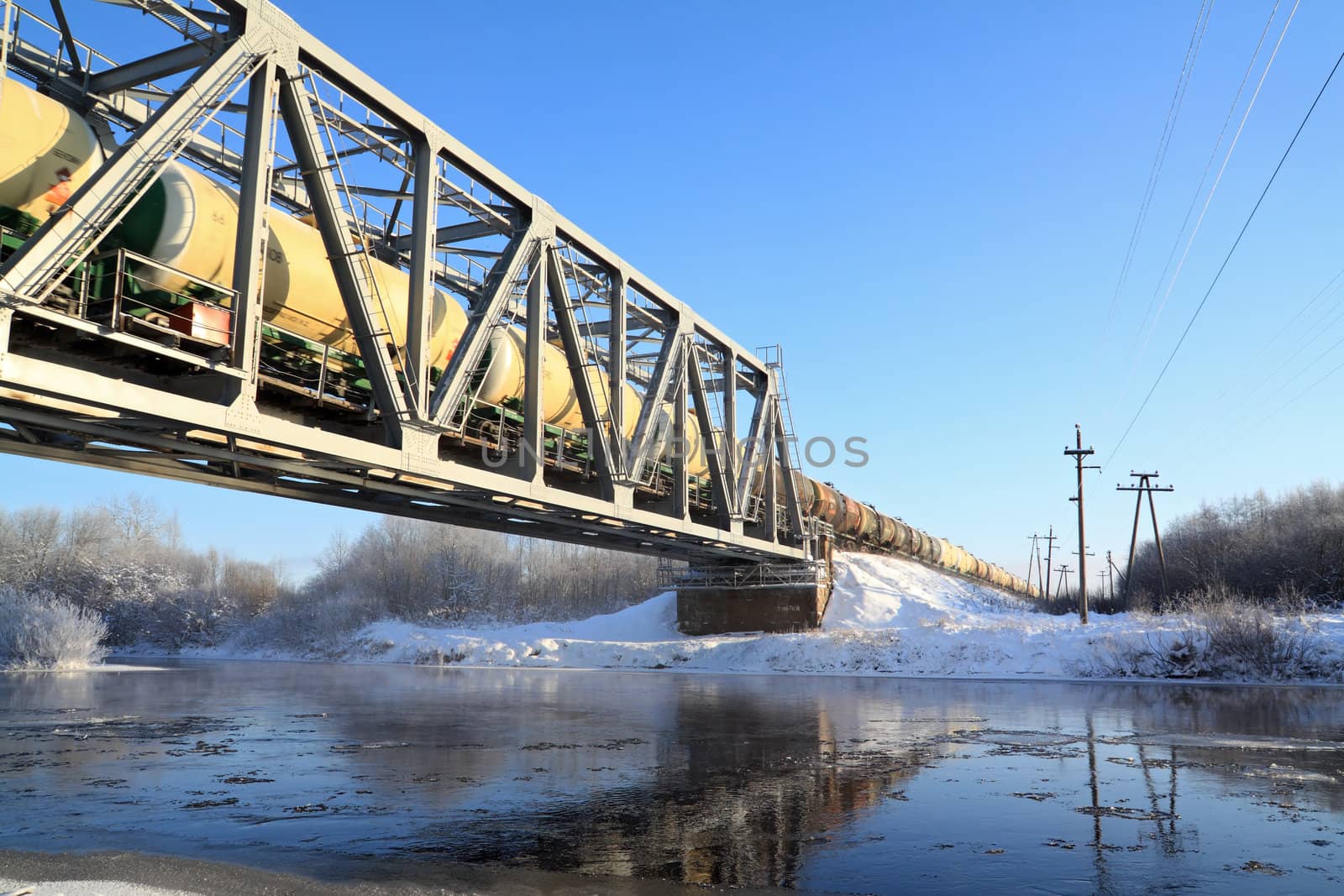 railway bridge through small river by basel101658