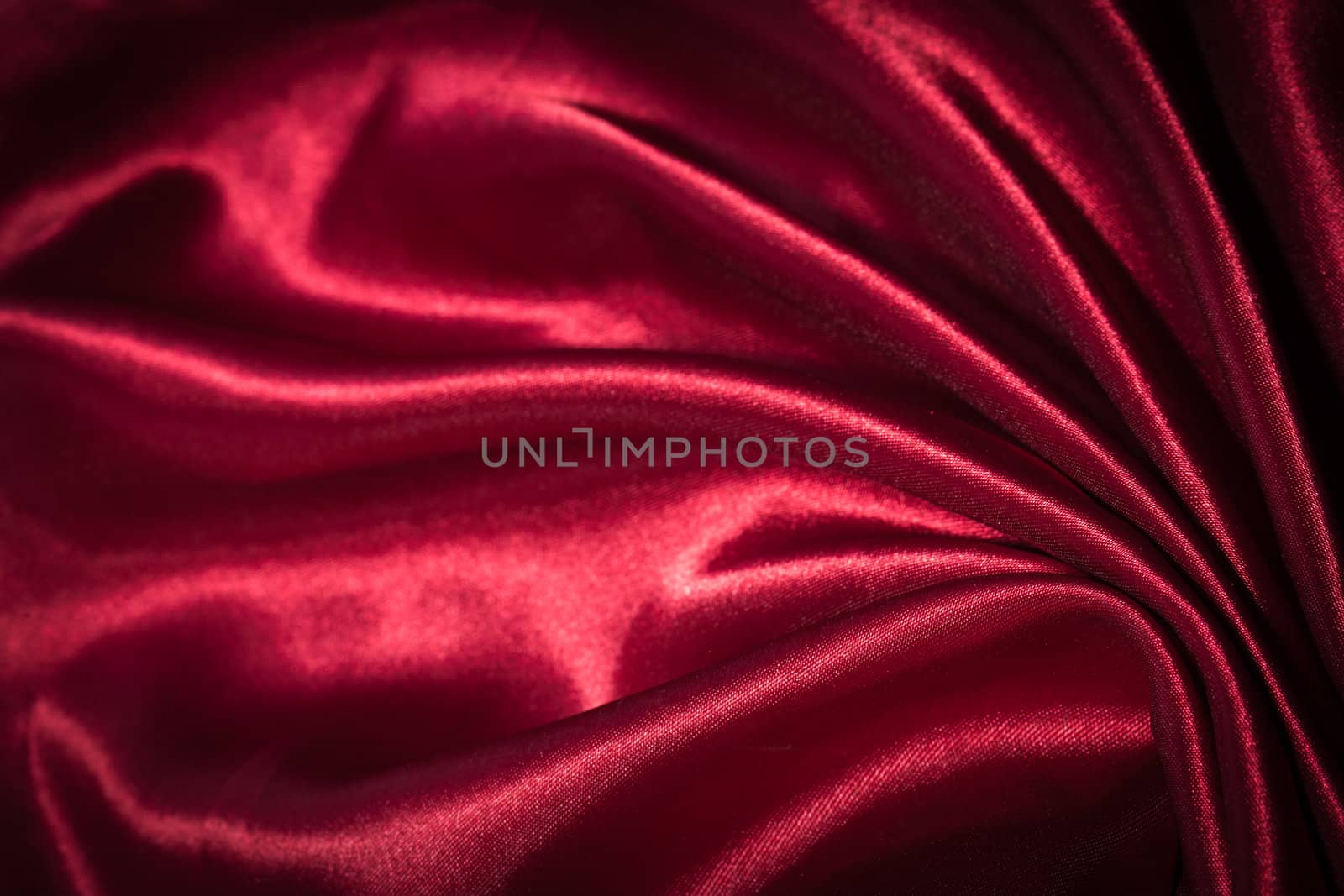 Red silk textile background by Suriyaphoto