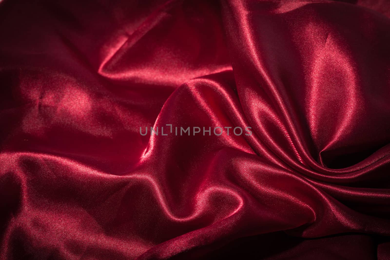 Red silk textile background by Suriyaphoto