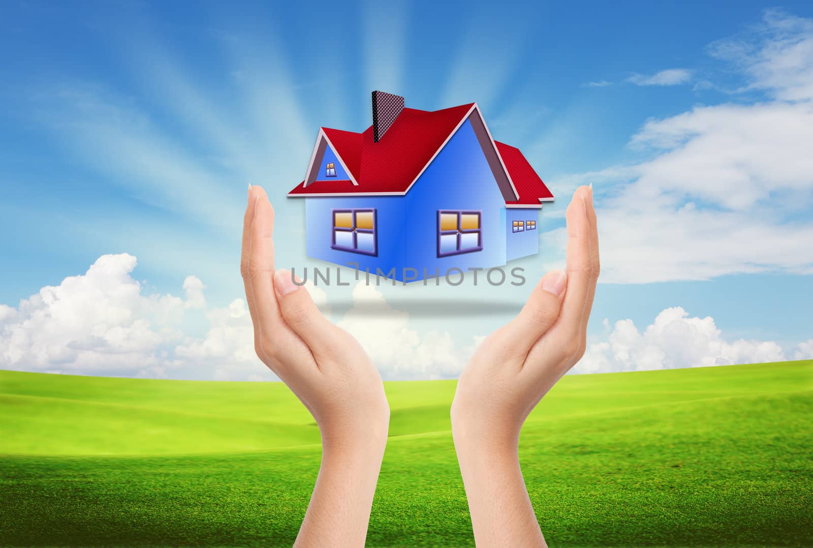 The House in the hands against the blue sky as a symbol of the real estate business.