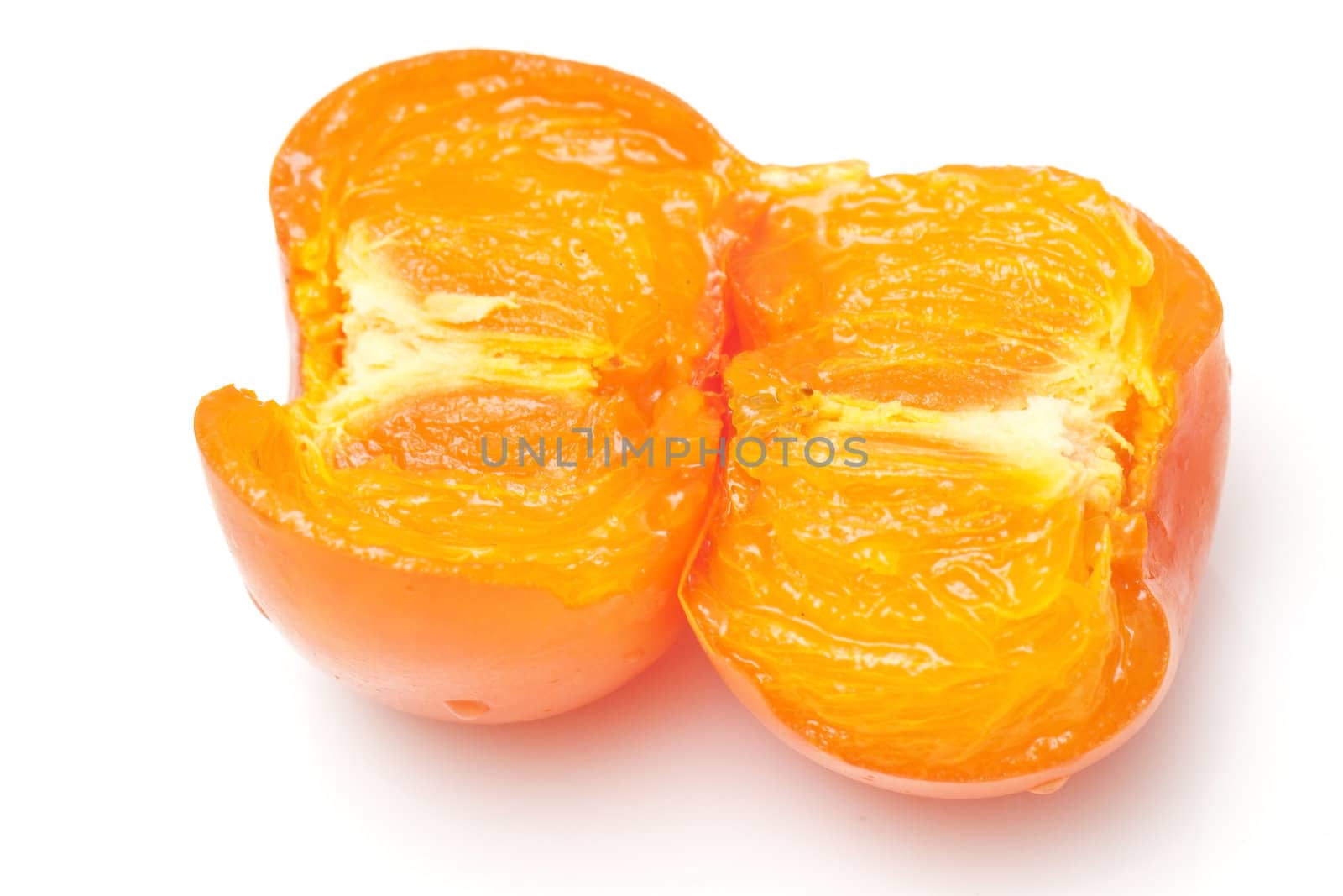 An opened orange persimmons isolated on white background  by kawing921