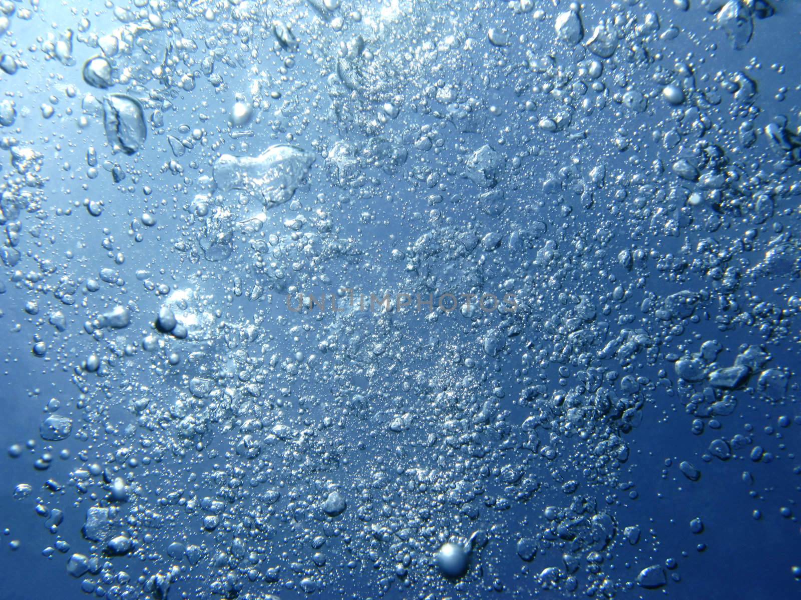 Air bubbles, blue water, abstract background
