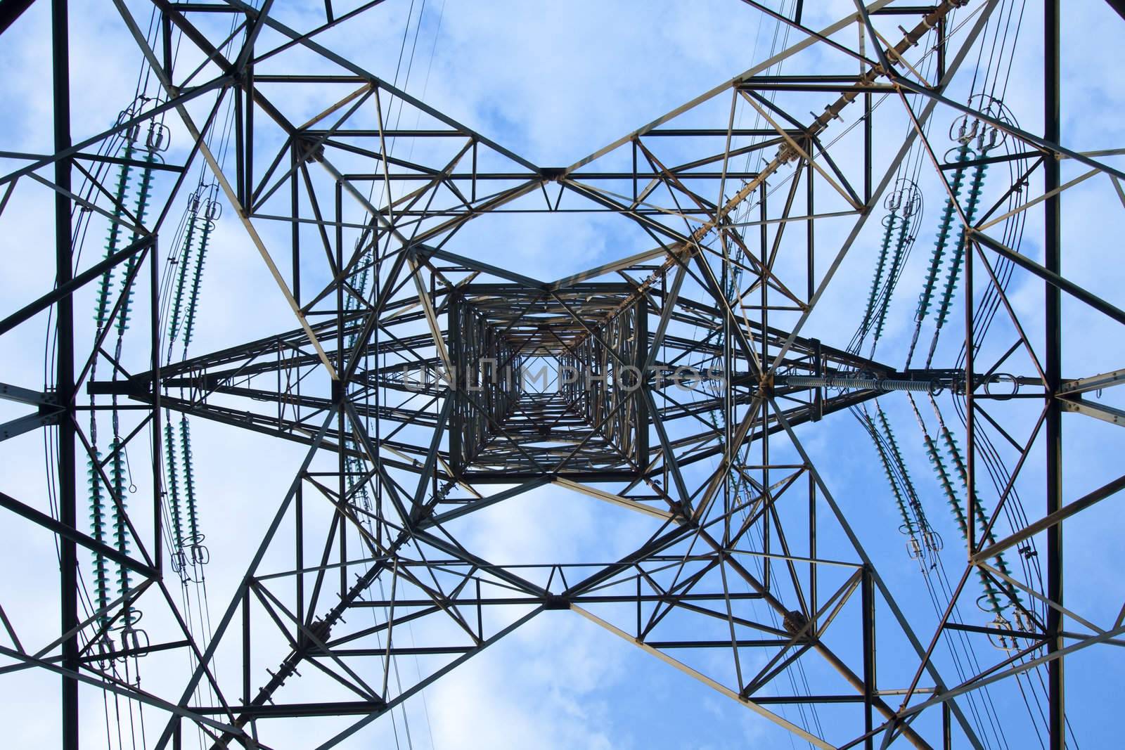 Electrical tower over a blue sky background by kawing921