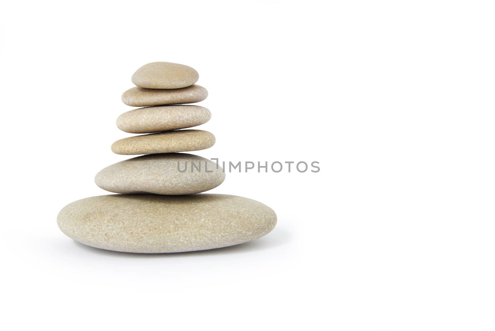 Stack of balanced stones on a white background