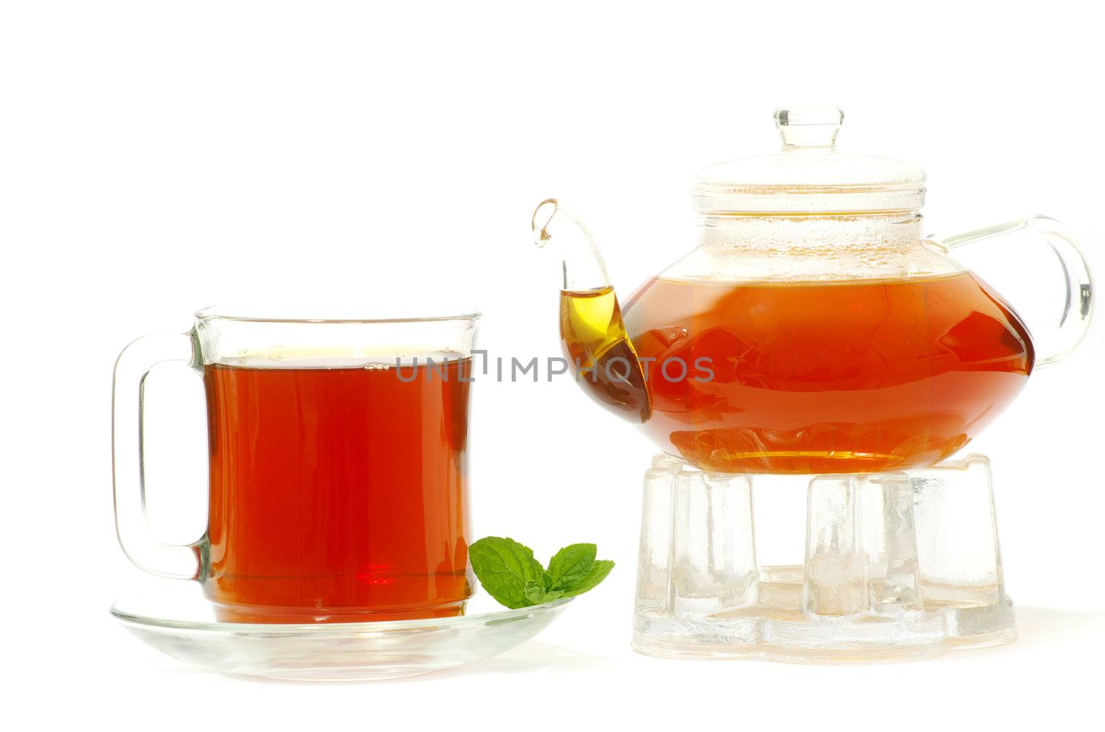 Tea being poured into glass tea cup