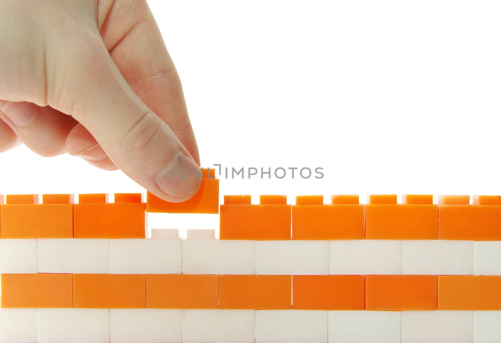 compleeting the wall on a white background