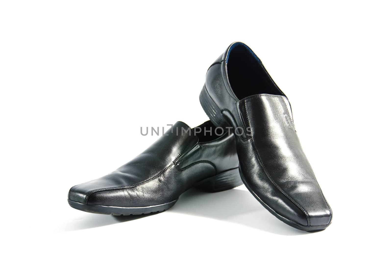 Black leather shoes on white background.