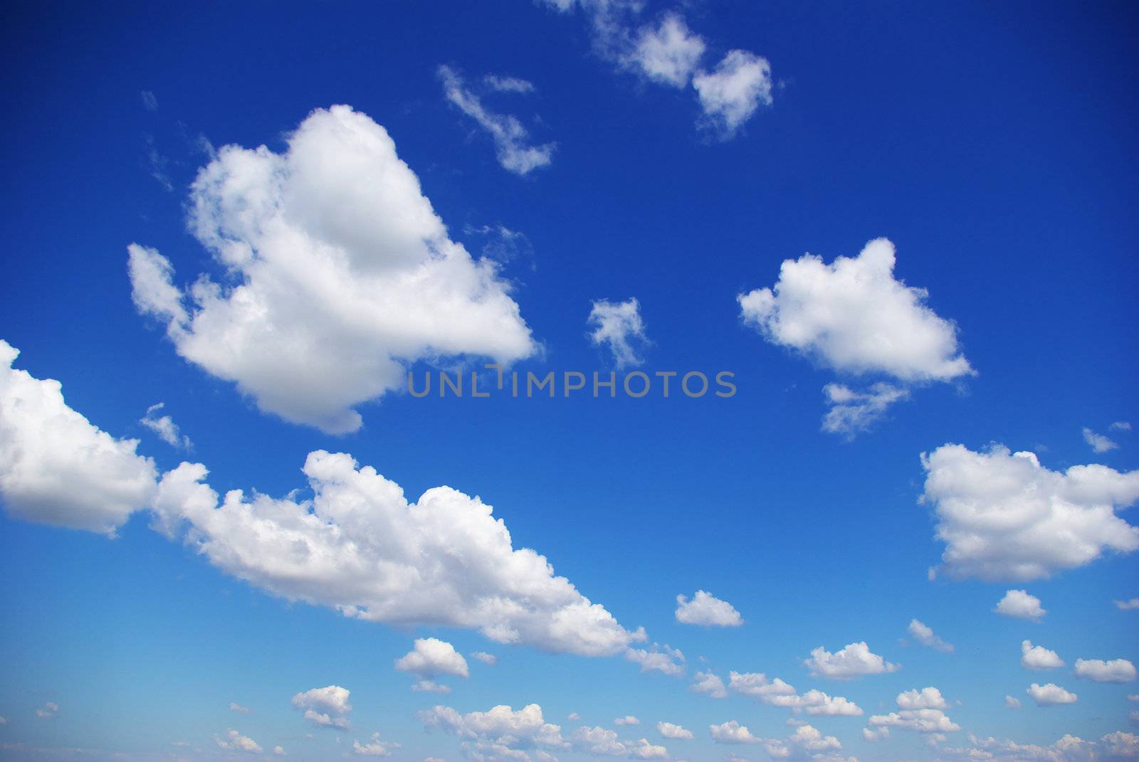 blue sky background with tiny clouds