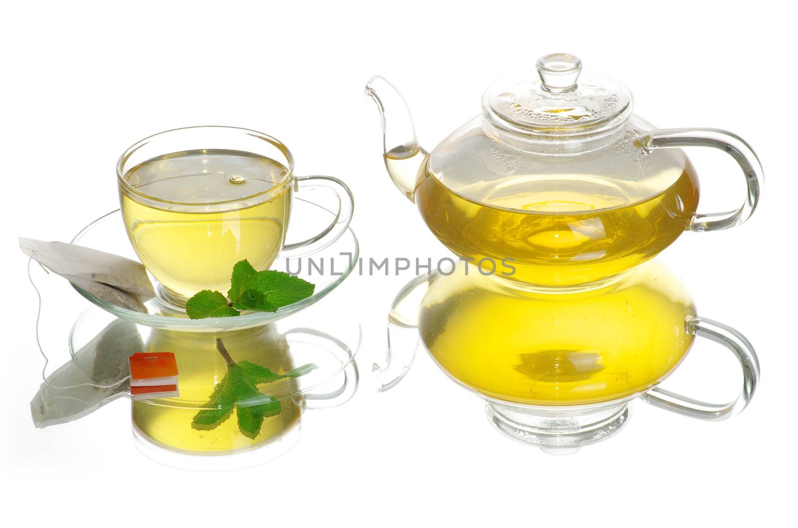 Tea being poured into glass tea cup