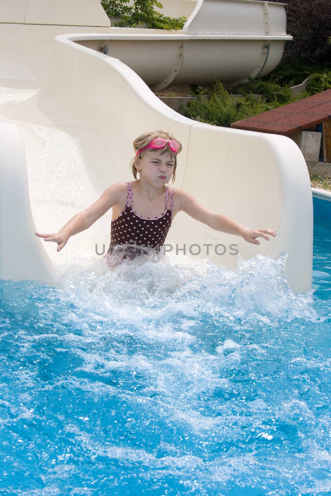 Girl going down a water slide
