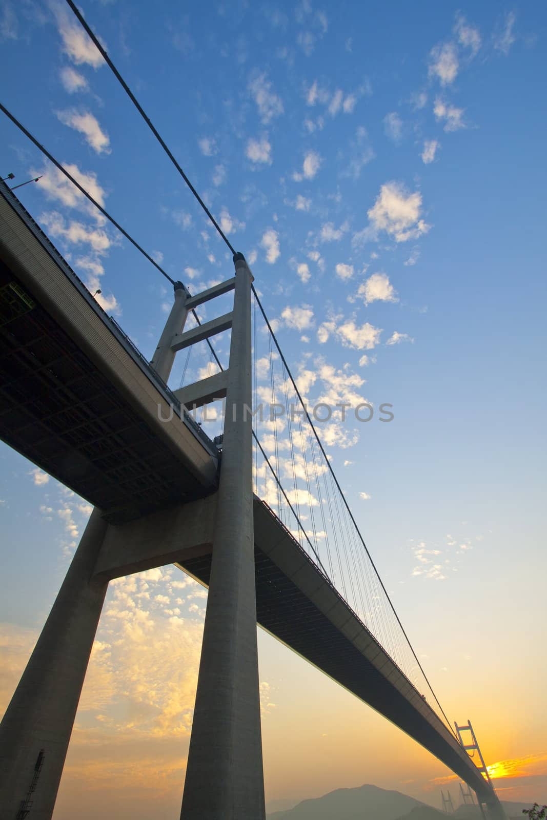 Tsing Ma Bridge in Hong Kong at sunset time by kawing921