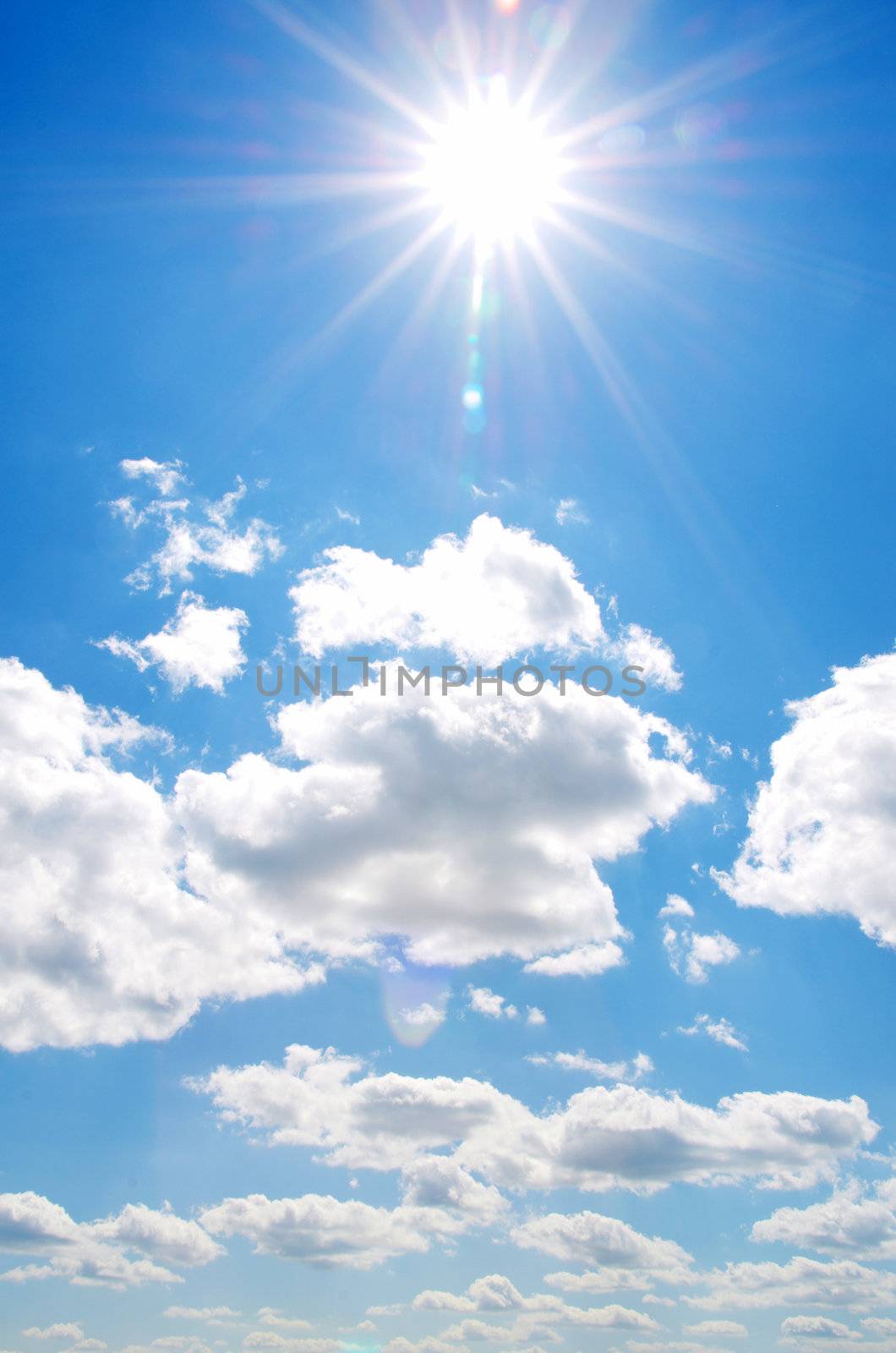 Blue sky background with tiny clouds