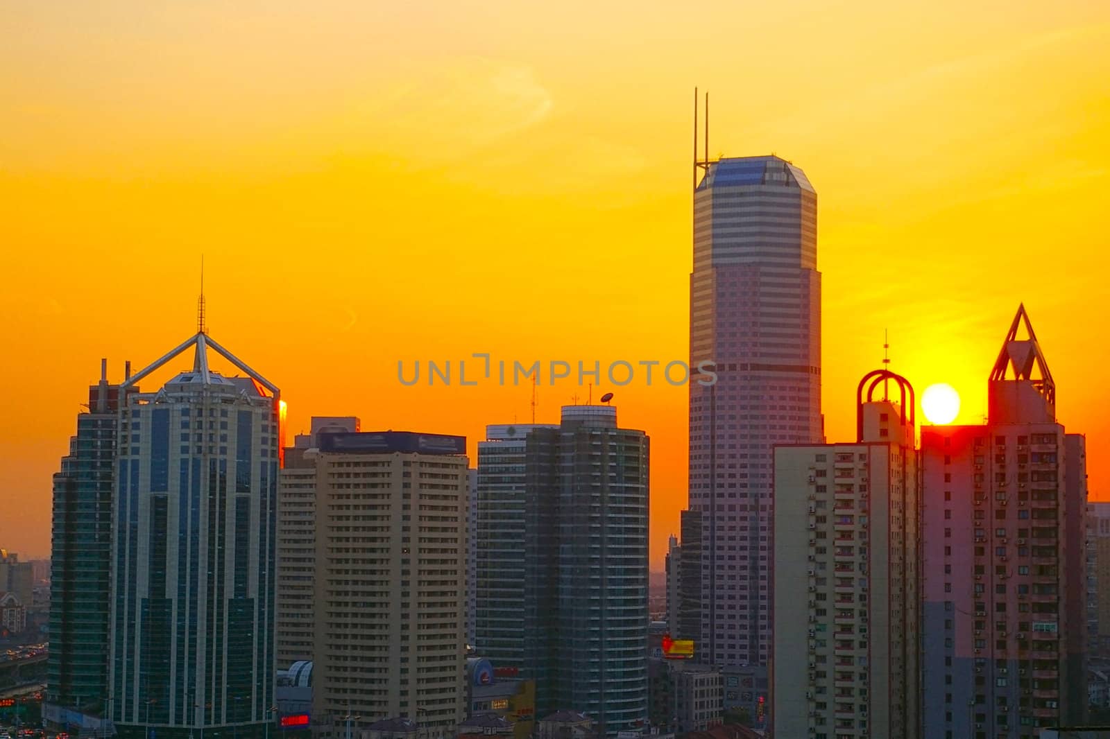 Shanghai sunset with skyscrapers background