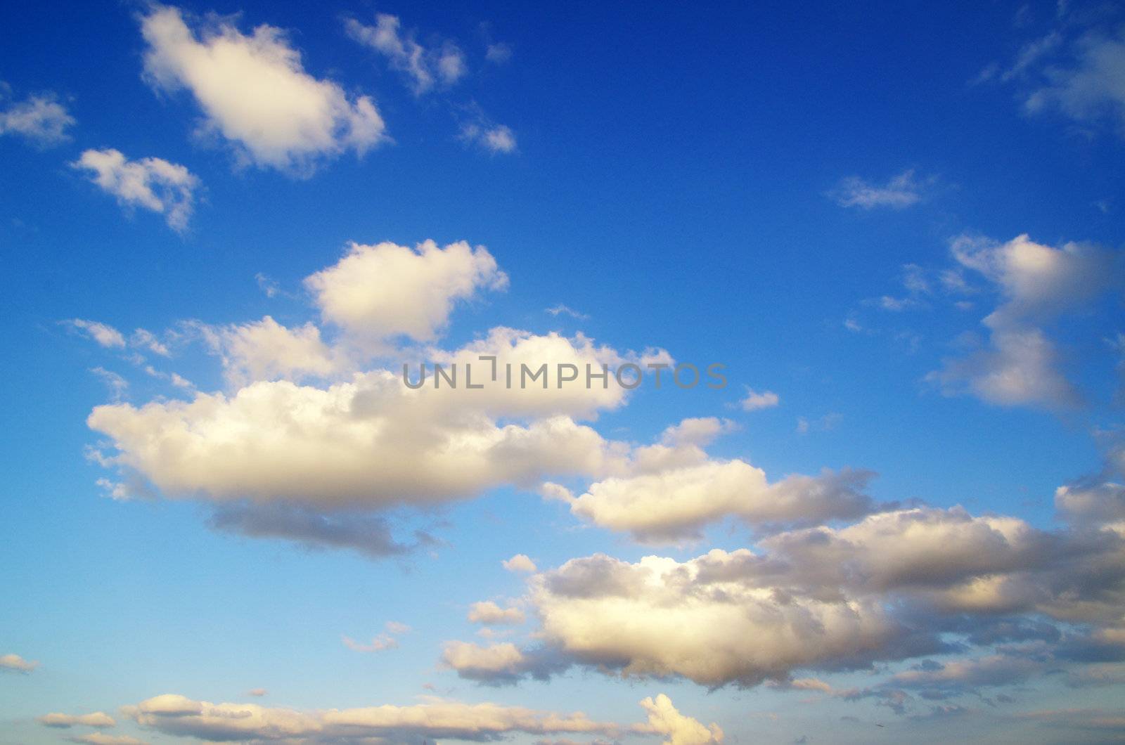 blue sky background with tiny clouds