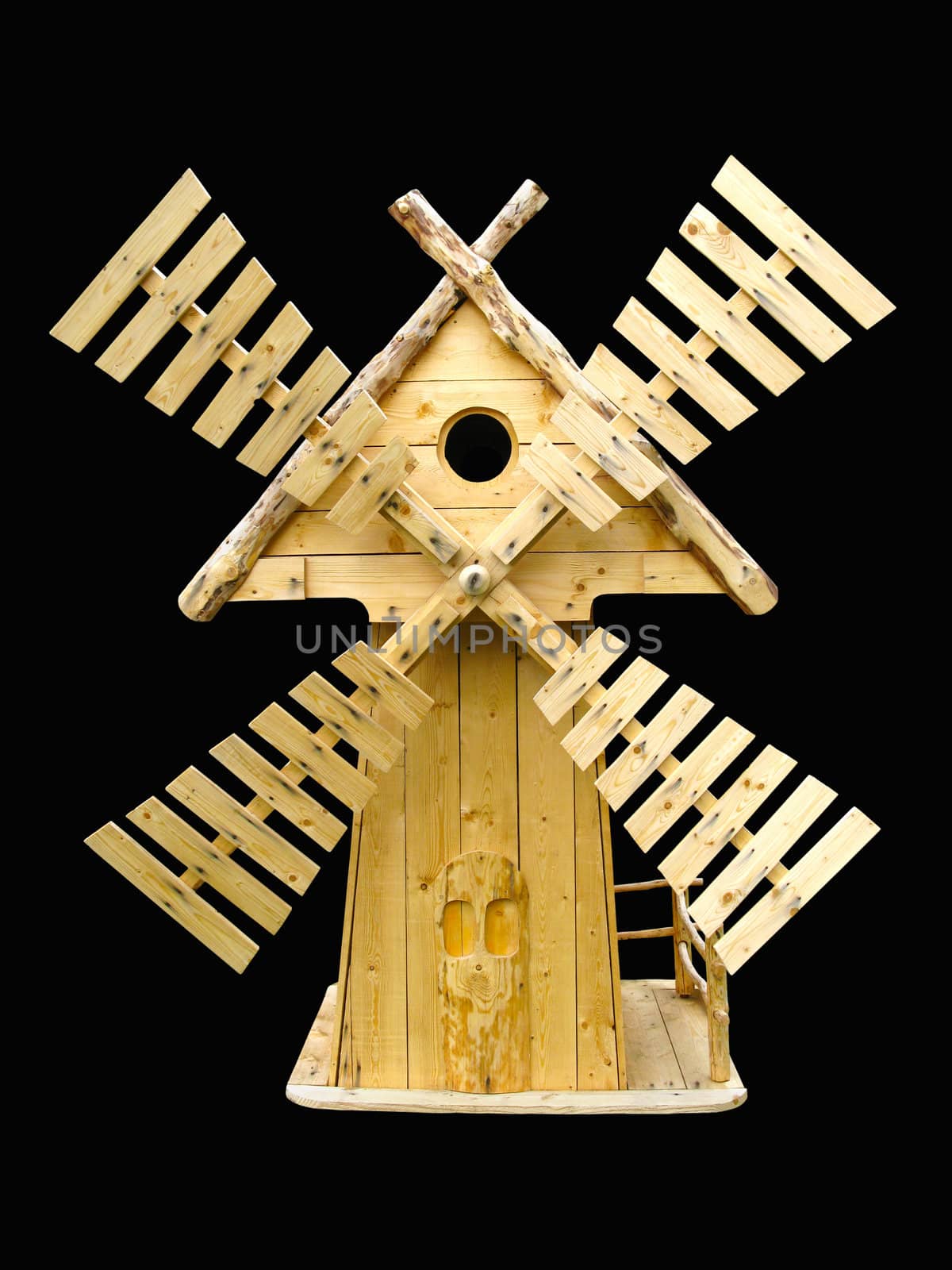 Isolated decorative wooden mill on a black background