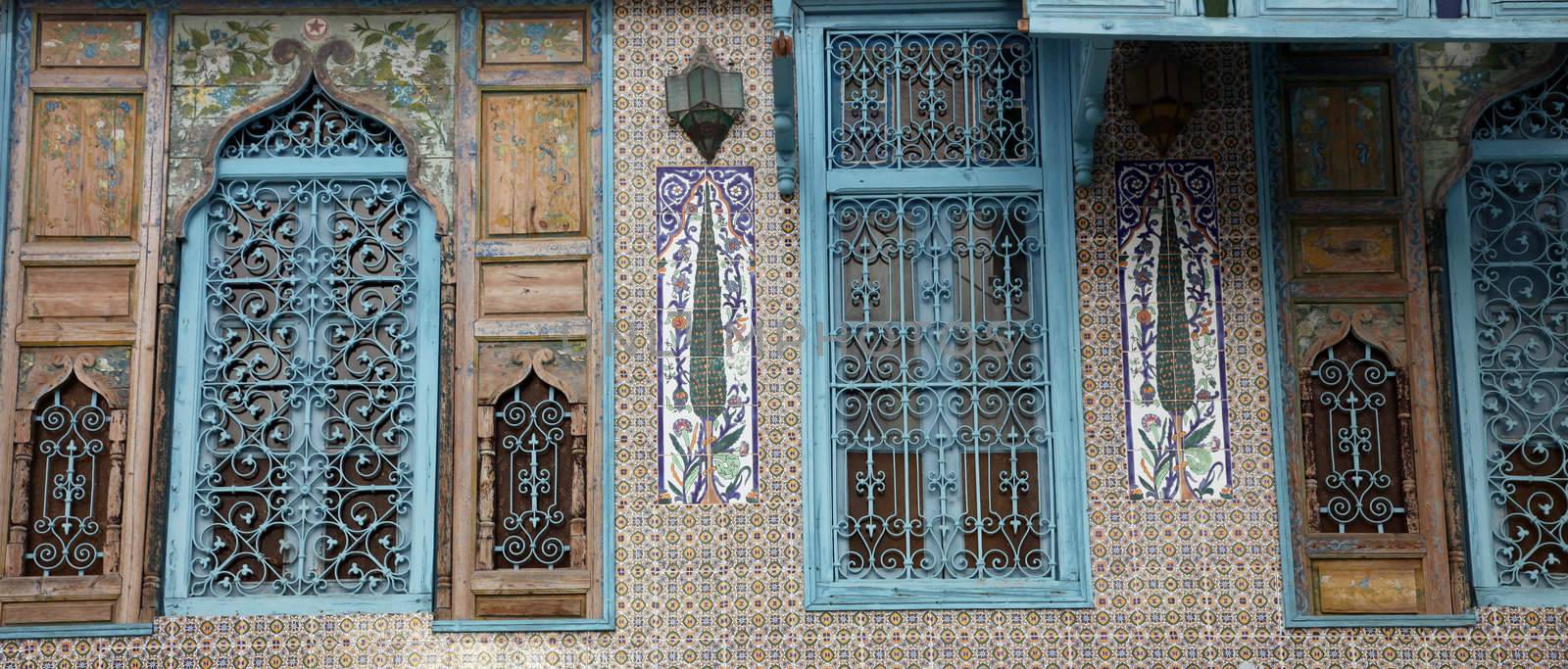 Old Tunisian window with classical Arab ornaments by atlas