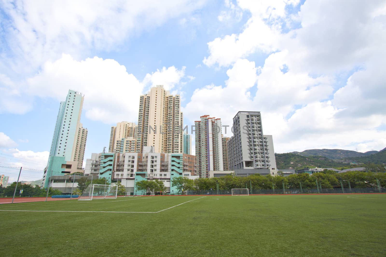 Hong Kong downtown with residential buildings and sports court