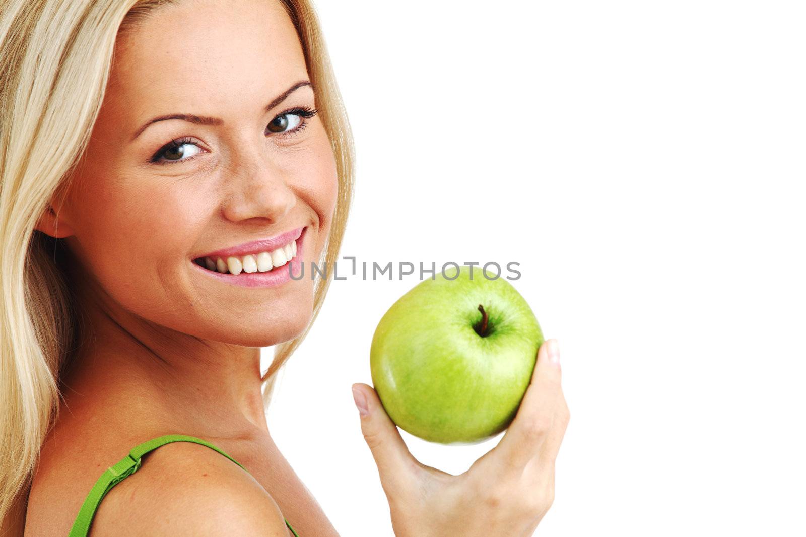 blond woman eat green apple on white