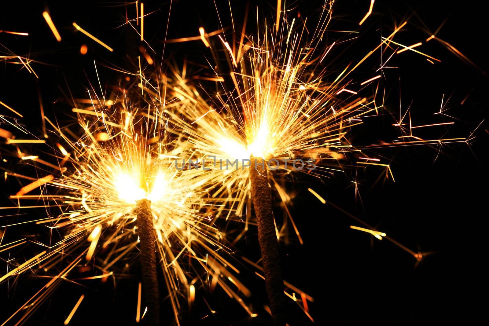 christmas celebration sparklers on black background