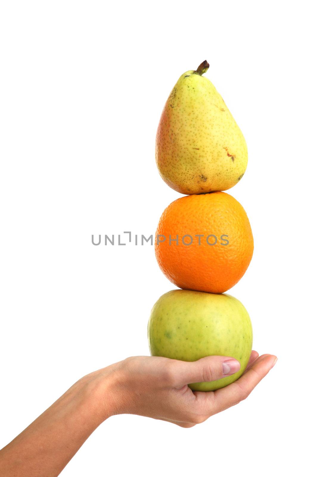 fruit pile in woman hands on white