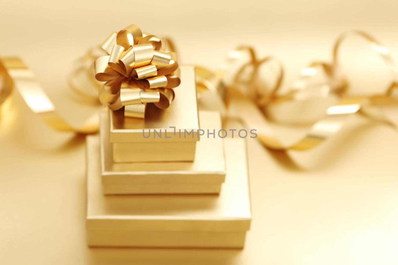 golden christmas gifts on gold background 