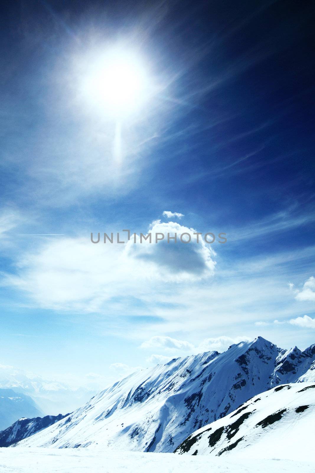 top of mountains in blue sky