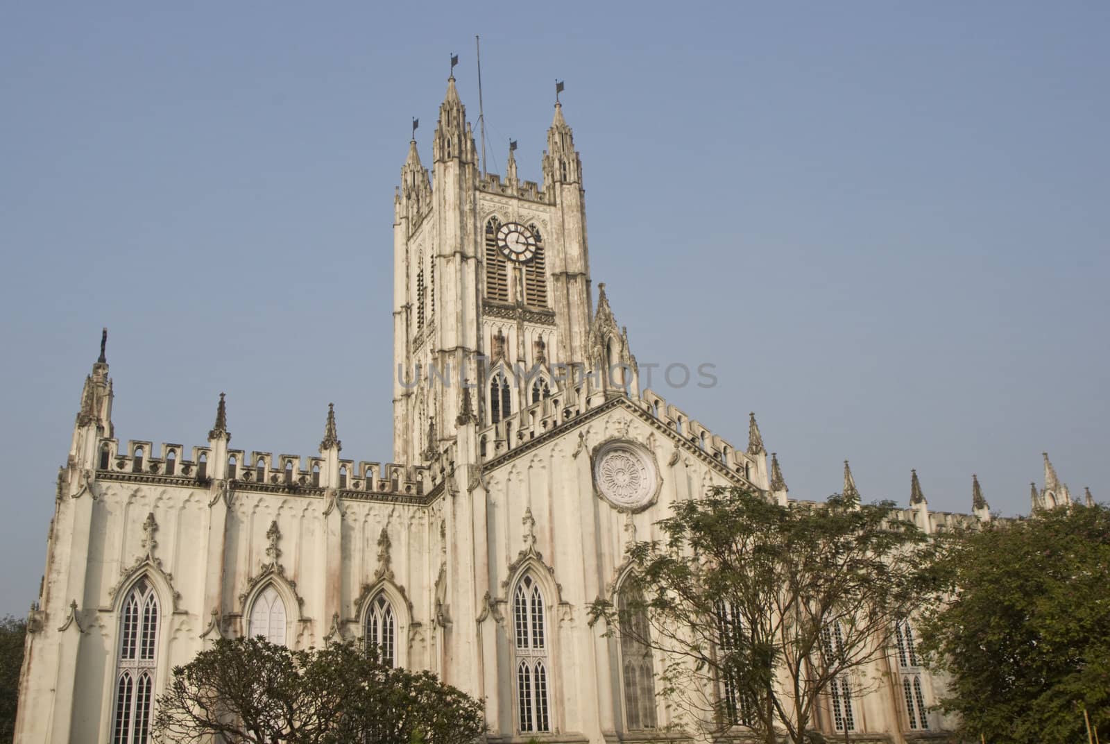 Main tower of St Paul's Cathedral in Kolkata, India. Gothic style white building completed in 1847.