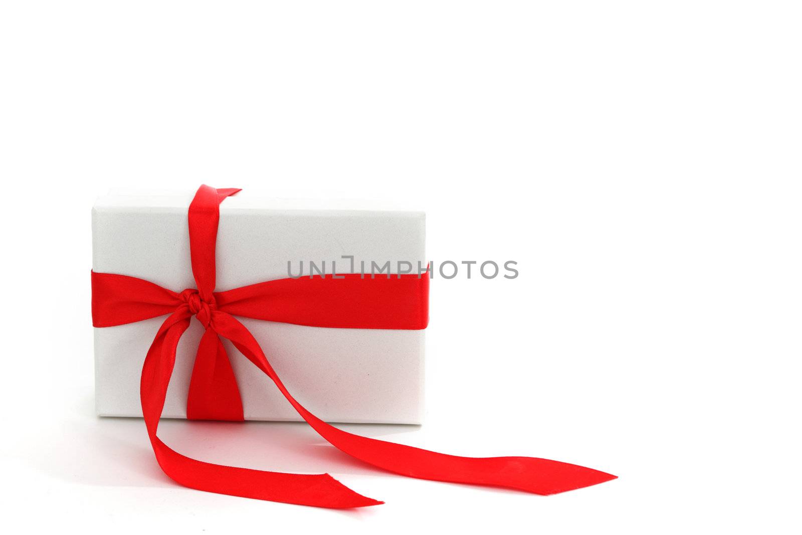 white christmas gift with red ribbon