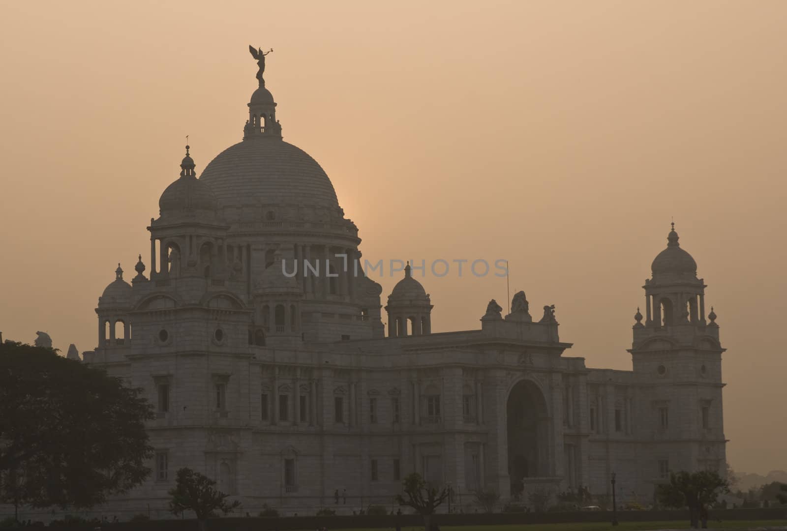 Victoria Memorial in Kolkata, India. Ornate white marble building at sunset.
