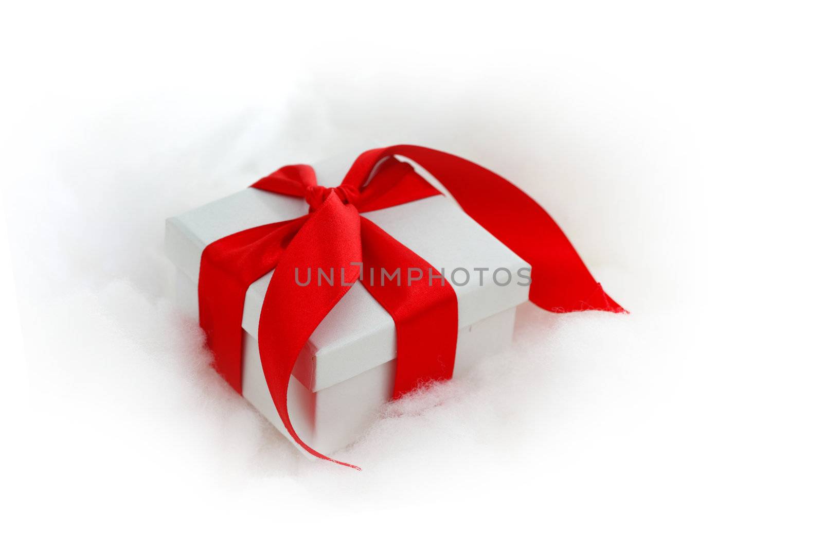  white christmas gift with red heart ribbon