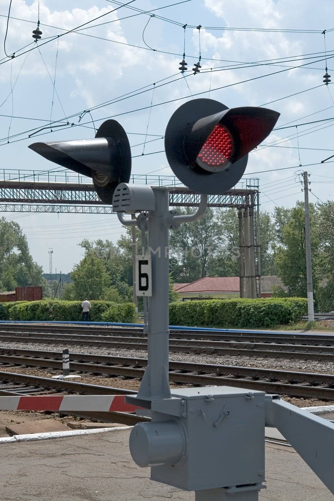 Summer. The railway. A semaphore. A red signal.