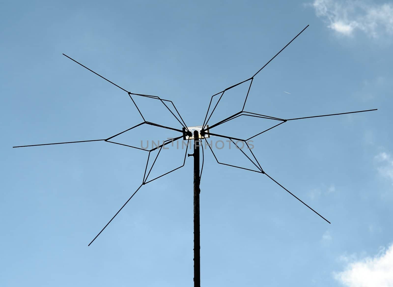 home-made television antenna with sky at background