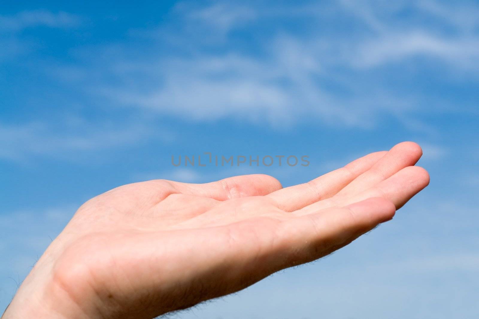 support. hand gesture with blue sky at background