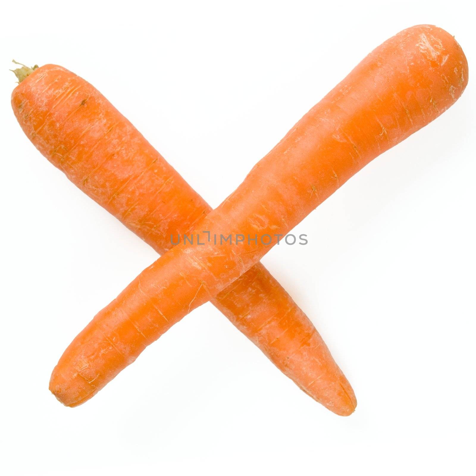 plus or multiplication sign. fresh orange carrot on a white background