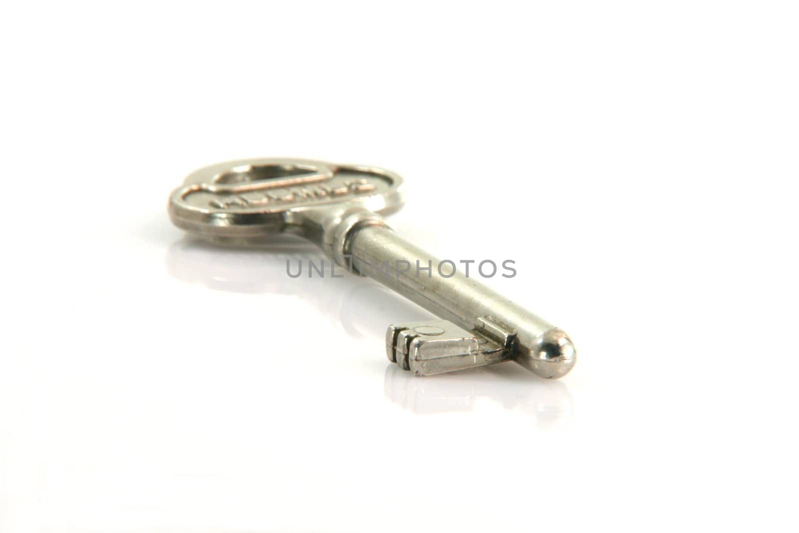 retro key isolated on white backround with reflection
