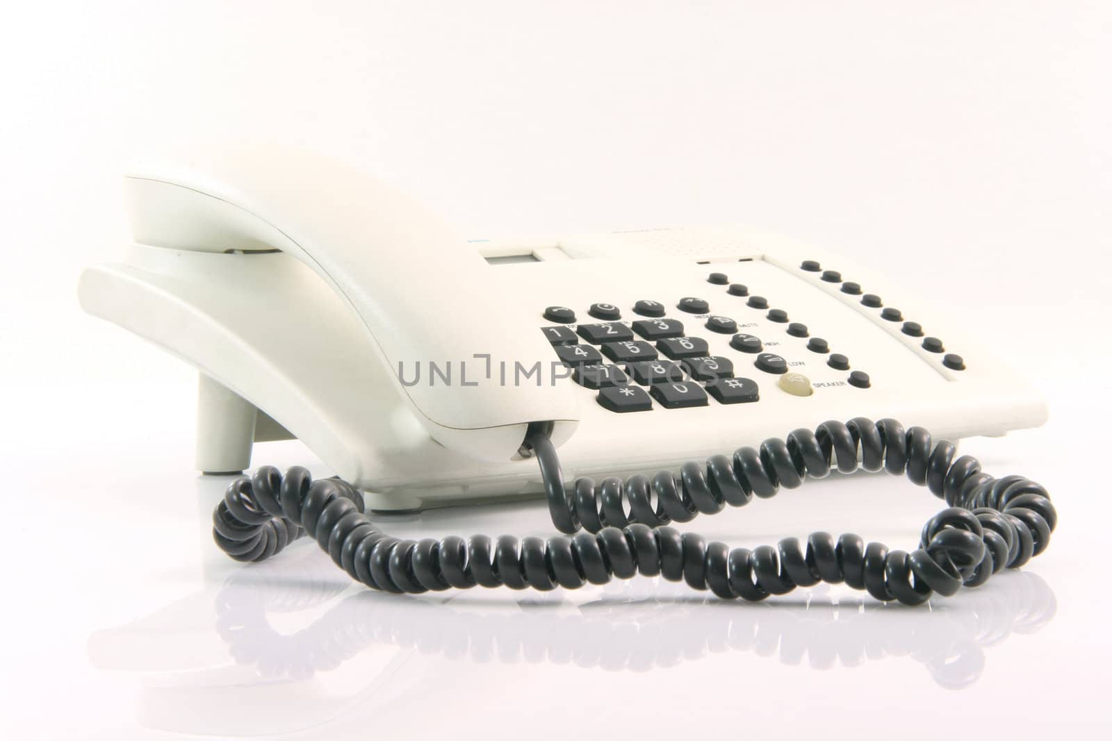 white telephone device with reflection on white background