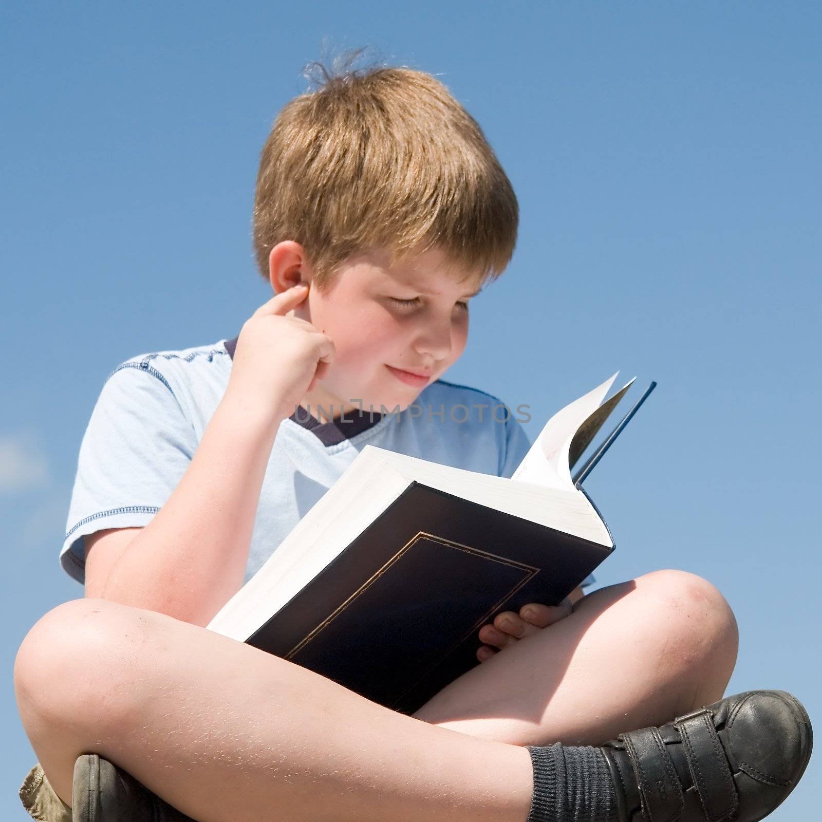 boy reads book by stepanov