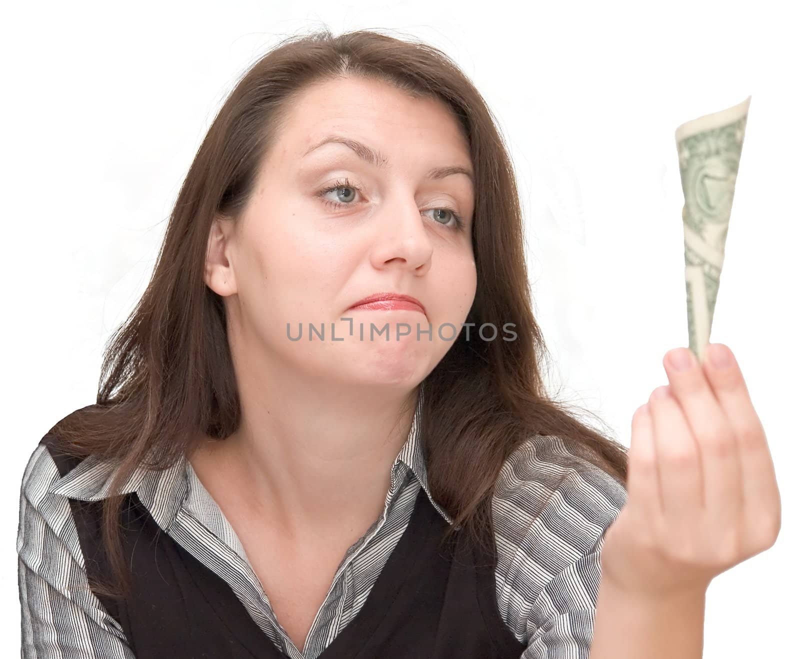 The girl disappointedly looks at one dollar