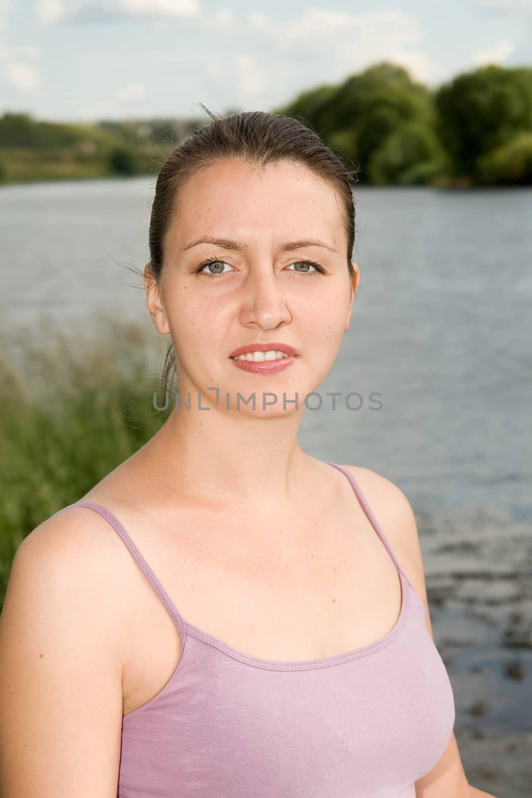 half-length portrait. young woman smiles. Outdoor