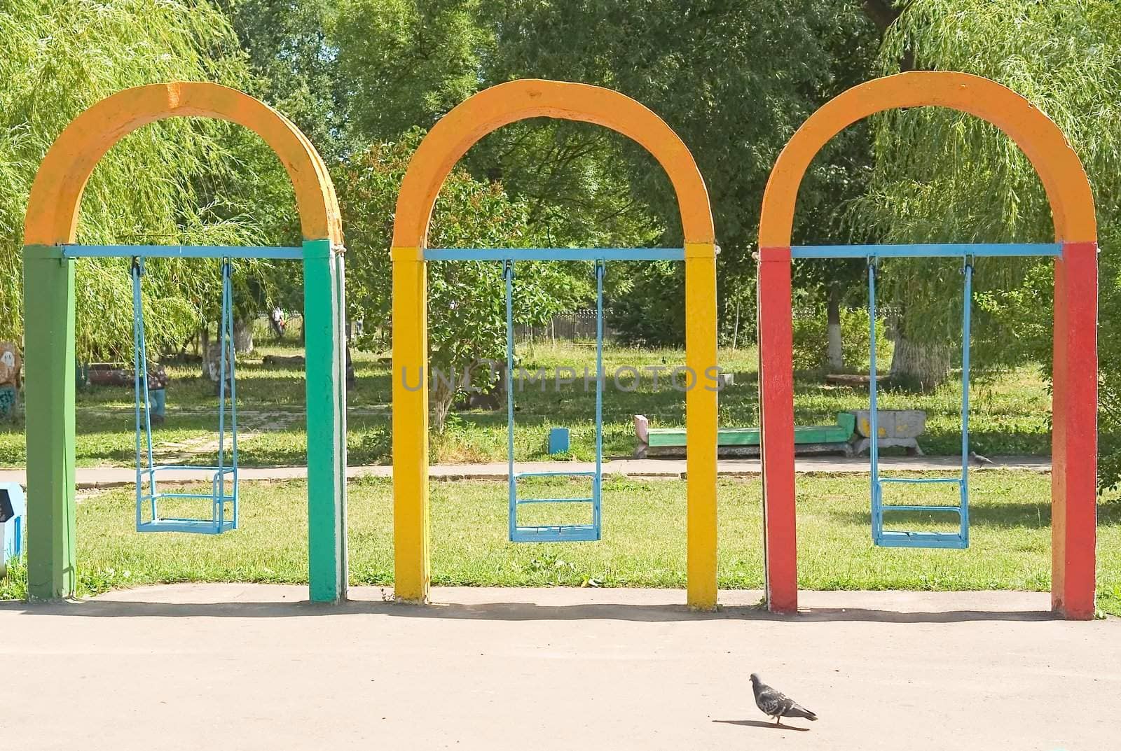 Multi-coloured swing in city park