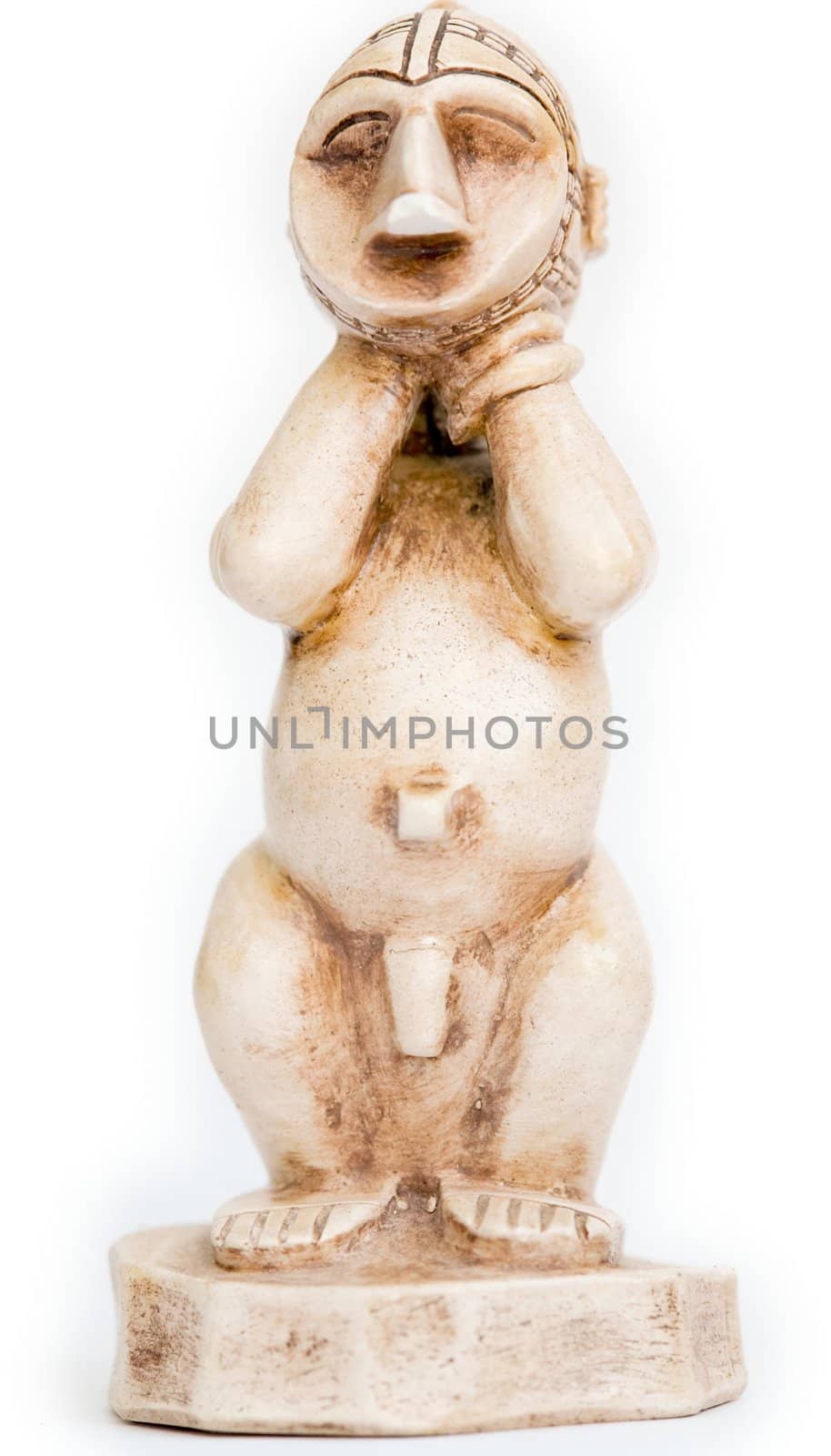 Small African figurine on a white background