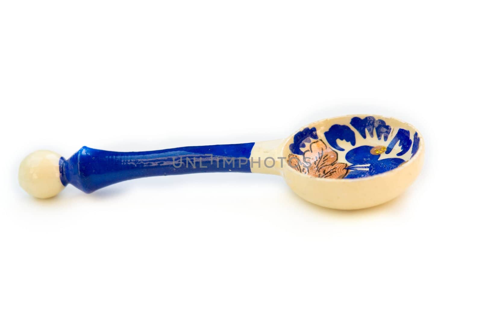 The small wooden spoon with old russian patterns.