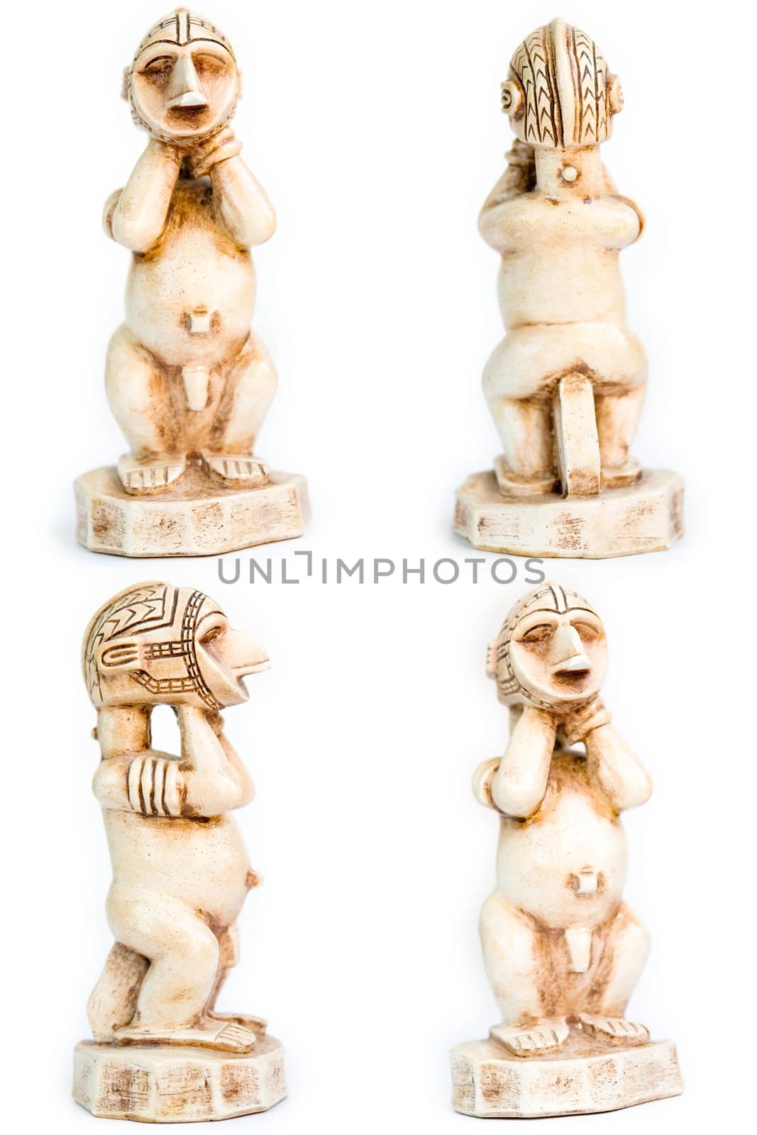 Small African figurine on a white background
