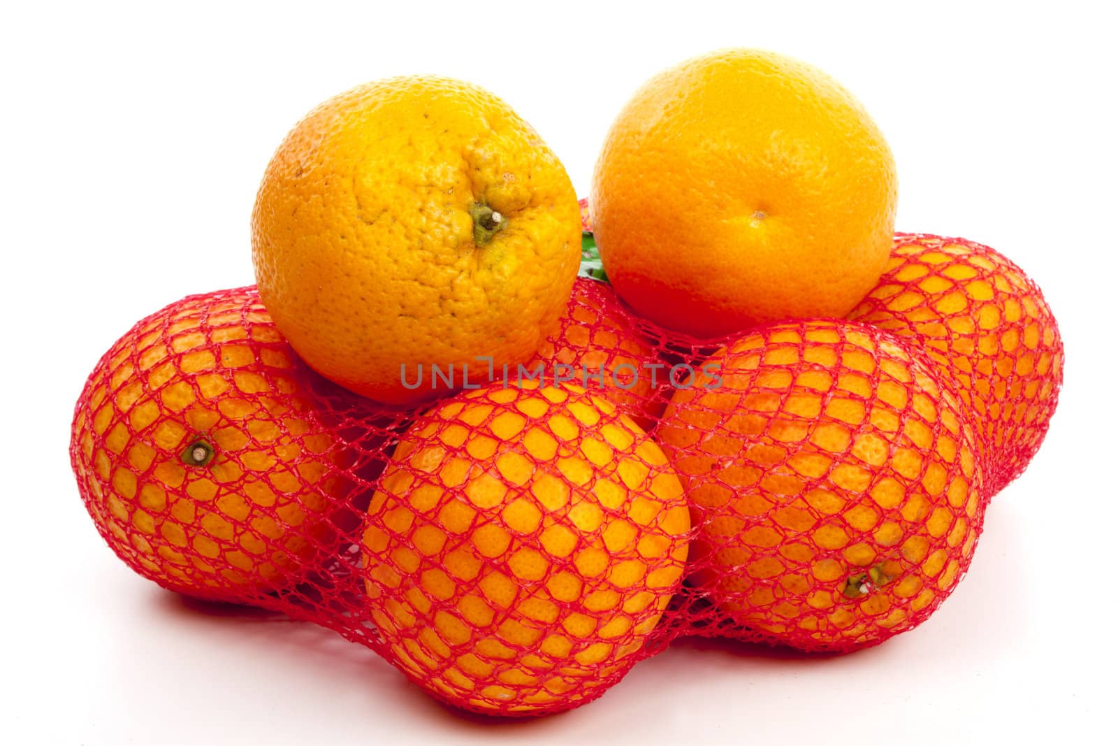 Mesh oranges from the supermarket. Isolated on white background 
