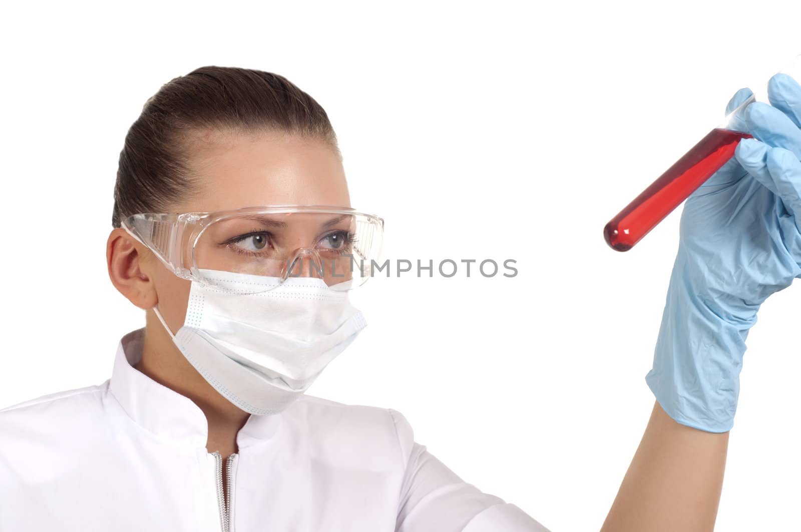 young woman scientist  chemist mixes the liquid in the tubes