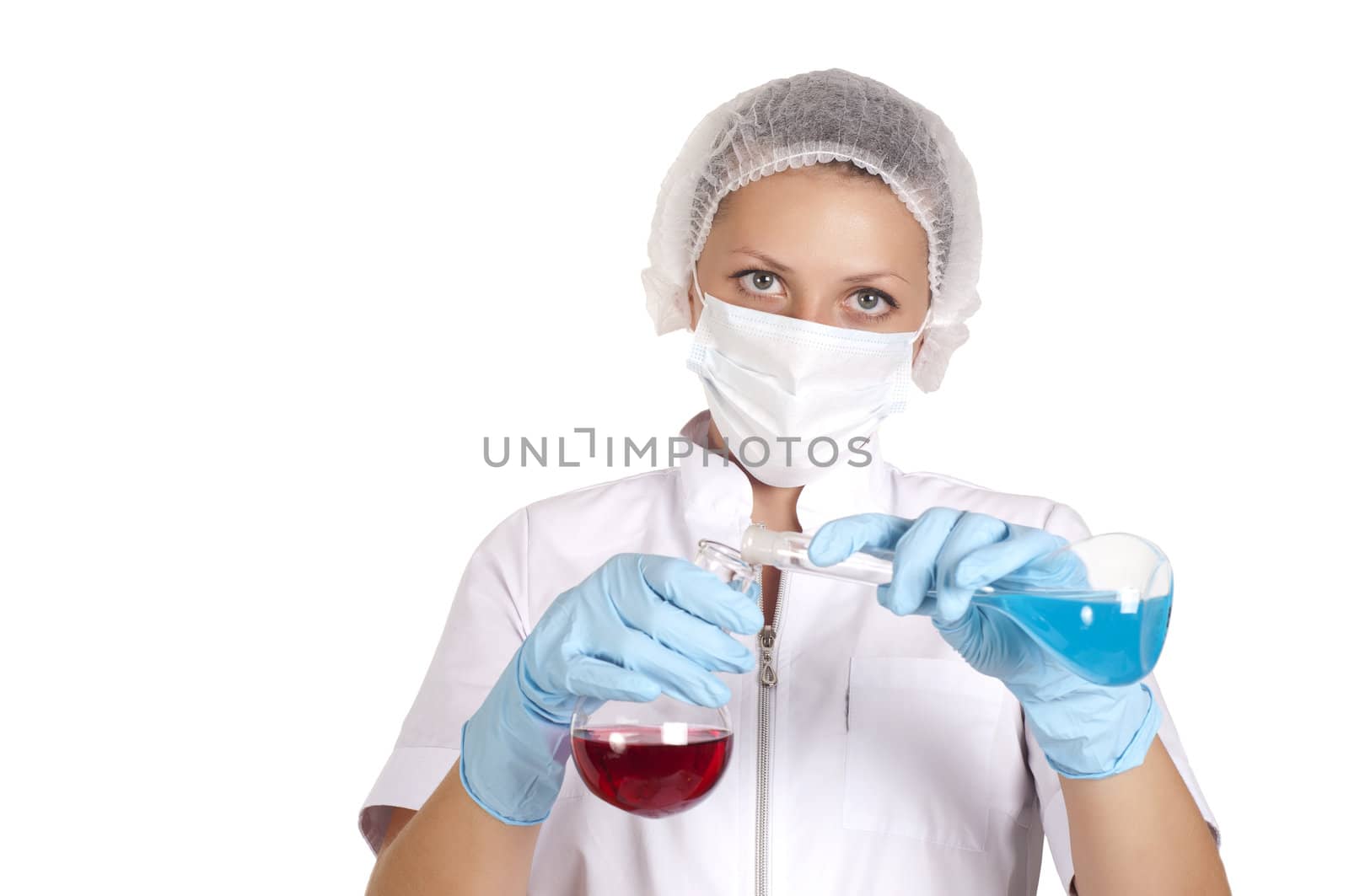 young woman scientist  chemist mixes the liquid in the tubes