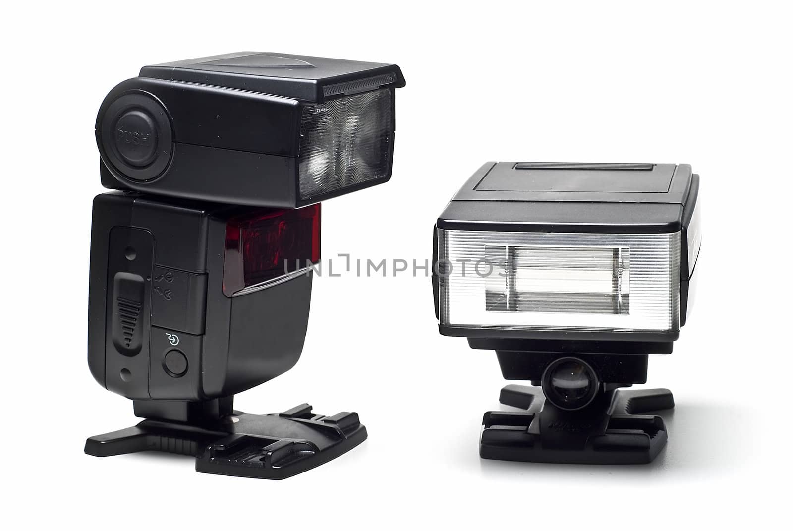 Two speedlight flashes isolated on a white background.