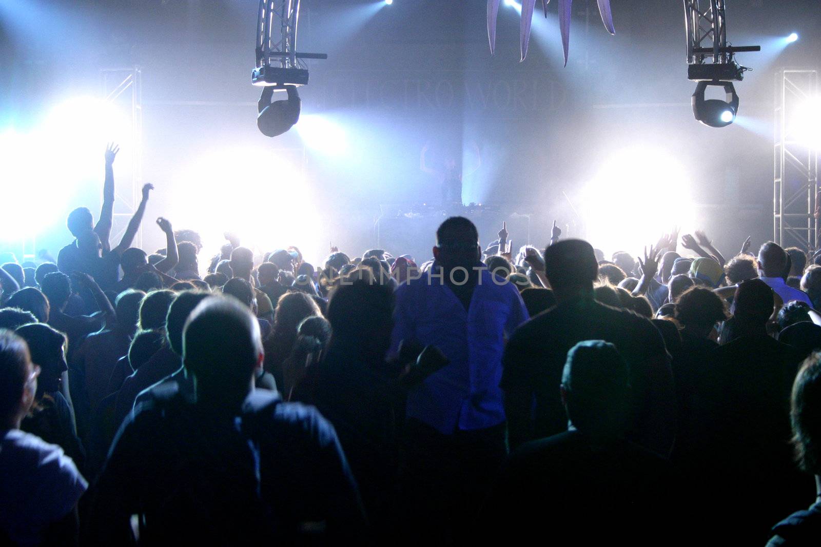 People jumping and dancing during a live concert